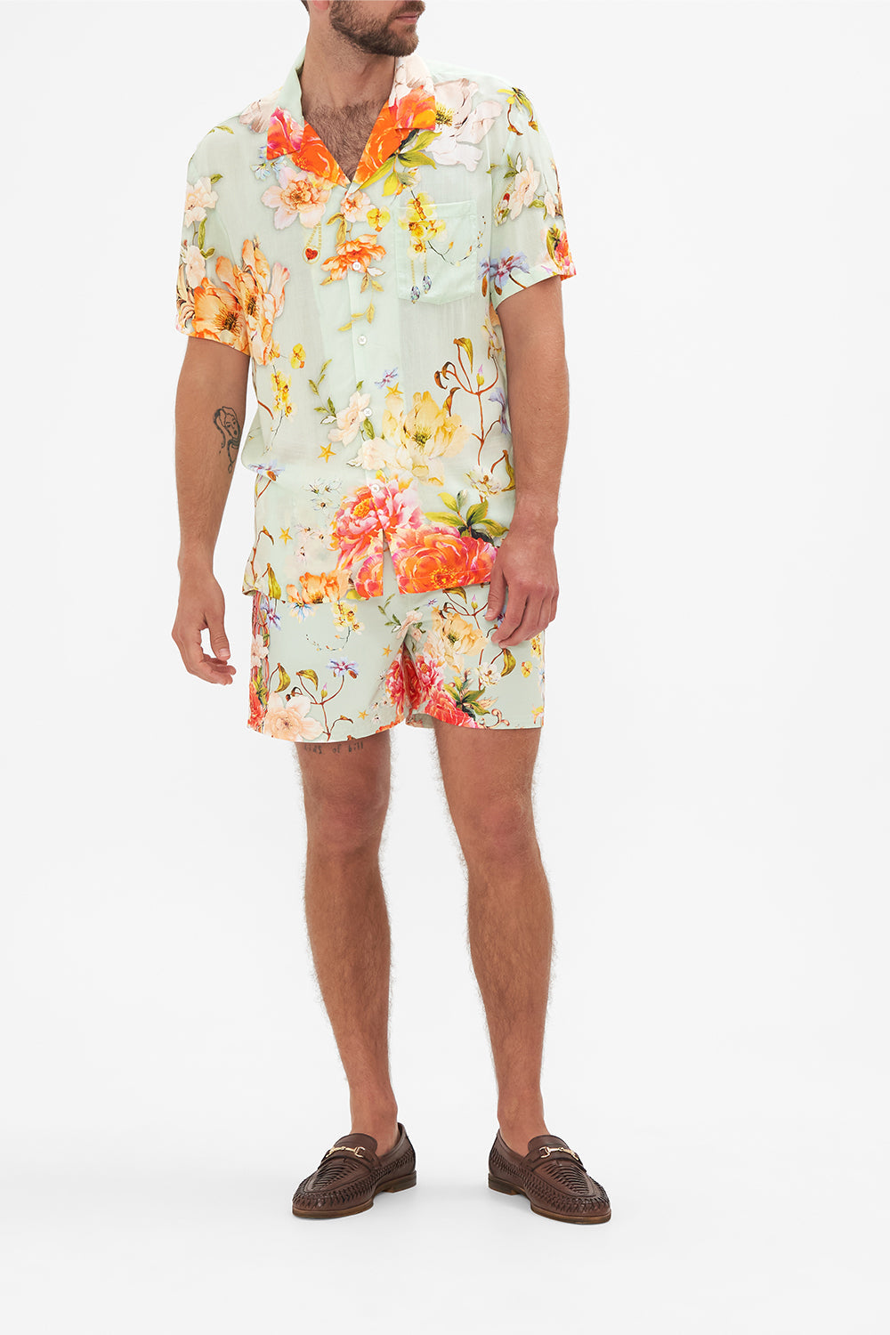 Front view of model wearing Hotel Franks by CAMILLA mens floral short sleeved camp collared shirt in Talk The Walk print